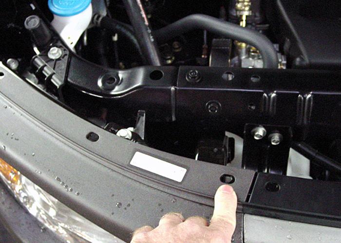 Remove the outside temperature sensor from the bumper core and use the two supplied zip ties to