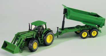 Maize header is height adjustable, and folds up for transport. Driver in the cab. Hinged side mirrors.