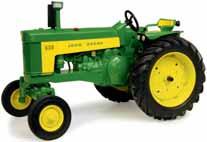 The tractor will have dual front & rear wheels / tyres, opening hood, opening left side cab door, three point hitch raises and lowers, die cast