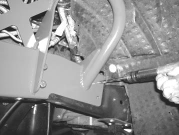 limit strap bracket in the rear mount hole on inside of frame 28.