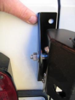 Install the upper hinge backing plate as shown using two of the 3/8 bolts and supplied flat