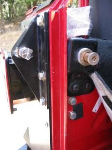 Tighten the two bolts in the fenderwell with supplied flat washer and lock nuts.