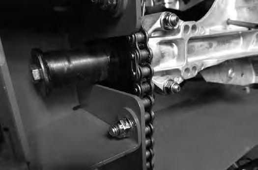Remove and retain the connecting link from the front axle chain sprocket.
