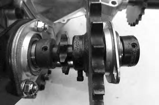 Remove the jack shaft from the transmission. The sprocket is keyed.