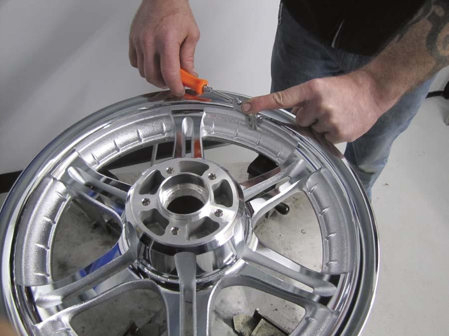 TECH by Chris Maida BLINGING OUT A FAT BOY Part II: Installing a new chrome Harley-Davidson 6-Spoke front wheel, polished rotor and a HardDrive Shinko 130/90-16" tire Here s Dan installing 1 the new