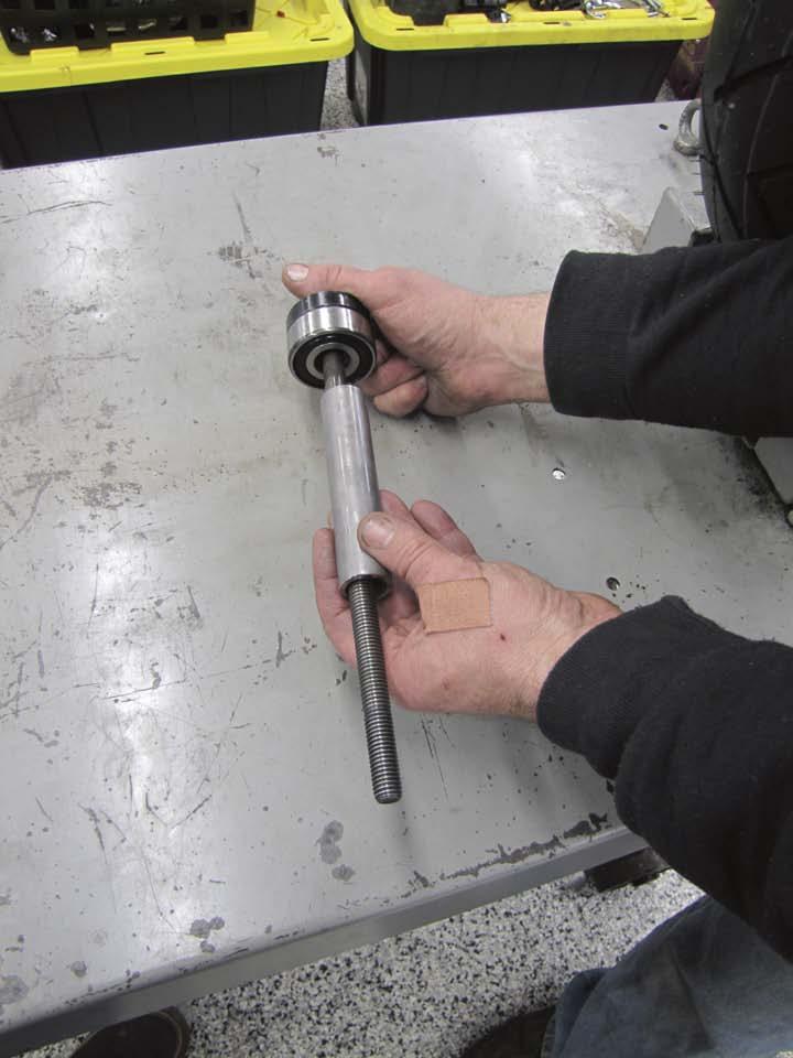 application), both from the H-D installation kit, onto the shaft of his wheel bearing installation