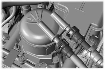 Maintenance E163362 3. Reinstall the lower portion of the housing by slowly turning it clockwise onto diesel fuel conditioner module housing, allowing fuel to soak into the fuel filter element.