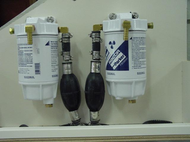 Fuel filters are installed in the transom area of the boat. The filters are the water separator type and there is one filter for each engine fuel line.