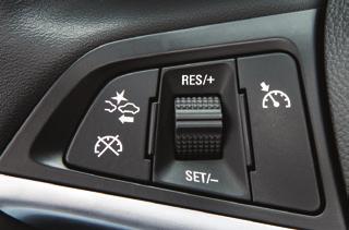 Tap the shift lever forward (+) to upshift or rearward ( ) to downshift. The current gear will be displayed on the Driver Information Center.