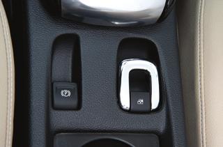 Start the engine or place the ignition in Accessory mode. 2. Pull or press and hold the Open/Close switch (B) on the center console until the top is fully opened or closed.