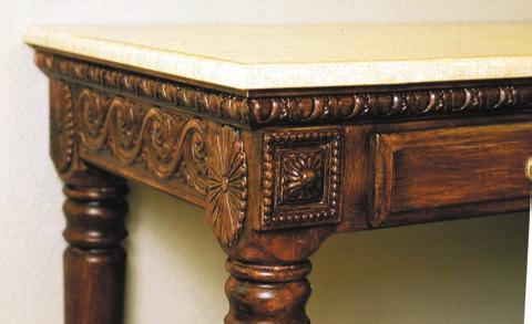 BELOW: Tastefully elaborate with rope columns supporting a wide frieze, these richly detailed