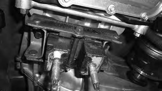 It is best to use a piece of wood to prevent damage to the transmission oil pan. 5.
