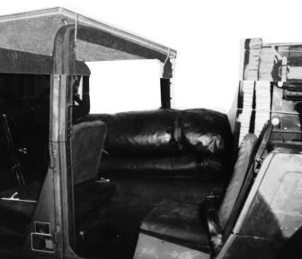 3 1 1 Fold and place the front and rear covers in the center of the passenger compartment of the vehicle. 2 Place the camouflage poles (not shown) to the right of the top covers.