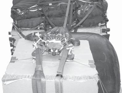 INSTALLING THE CARGO PARACHUTE RELEASE SYSTEM 4-7. Install the M- cargo parachute release system as shown in Figure 4-. Place the M- release on the release platform.