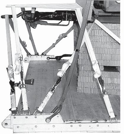 Note: Do not tighten the lashing so tight that the plywood bows. 4 9 8 6 Center the parachute stowage platform on the trailer drawbar.