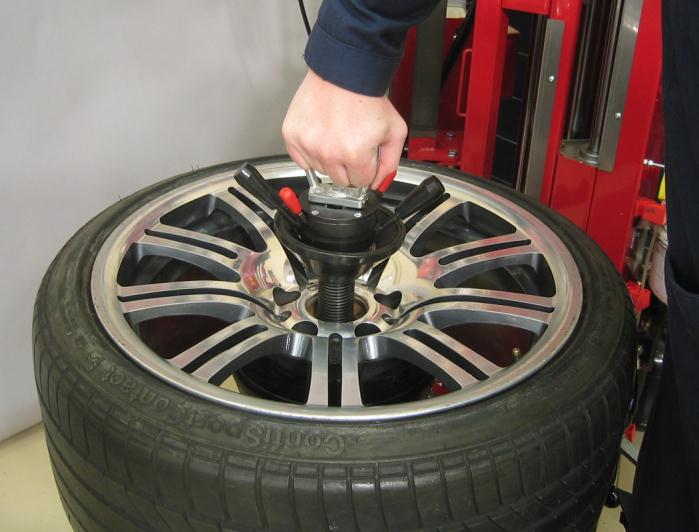 Ensure the anti-rotation pin enters a lug hole in the wheel.