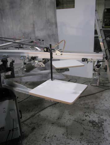 After finishing this step, lower the carousel arm, rotate the platen so that it is under print head #2 and raise the carousel arm.