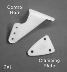 INSTALL AILERON CONTROL HORNS & PUSHRODS From the kit contents locate: (2) Nylon Control Horns (6) M2 x 15 mm Screws (2) 7-1/8 long Pushrod Wires with Hex Nut (2) Metal R/C Clevis (2)