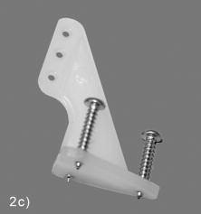 2) Mount one of the Nylon Control Horns on the bottom of each aileron by following these steps. a) Cut apart the control horn and the clamping plate.