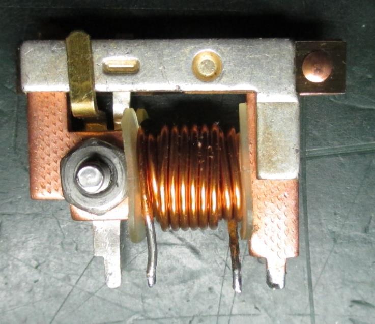 I reassembled the relay with a 4-40 button head screw, a small pattern nut and all relay functions work. I used a screw and nut in case I had to take it apart again.