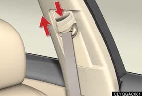 To lower: push the head restraint down while pressing the lock release