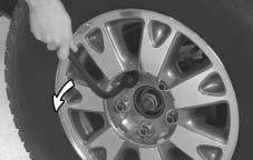 Remove these wheel nut caps before you take off the hub cap. 1. Using the wheel wrench, loosen all the wheel nuts.