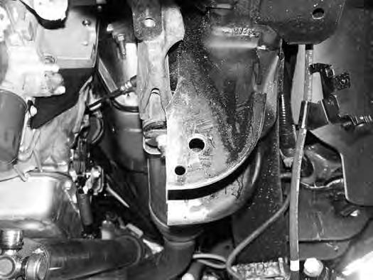FIGURE 15 27. Place the provided weld-in plate (02169) up against the cut edge of the control arm pocket.