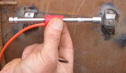To fit the gauge to the blocks, first slot the shaft of the gauge