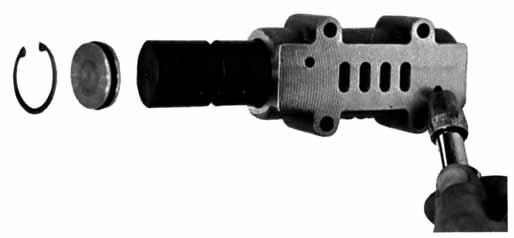 The bushing in the center block, along with the diaphragm shaft, provides the trigger to tell the air valve to shift.