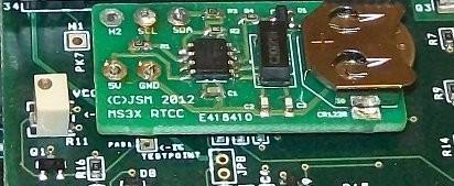 First ensure you are confident in this task, if not entrust to someone else or consult your dealer. Remove the upper case and MS3X card. Position the RTCC module as shown i.e. GND aligns with GND : 5V aligns with VCC : the empty pad H2 is above H2.
