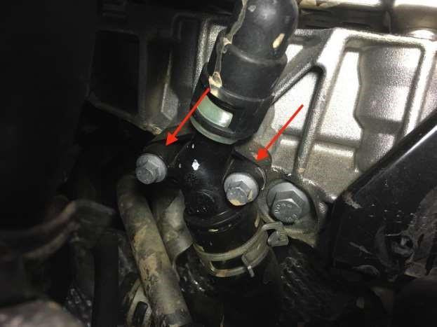 Remove the (2) 10mm bolts (Note: Coolant