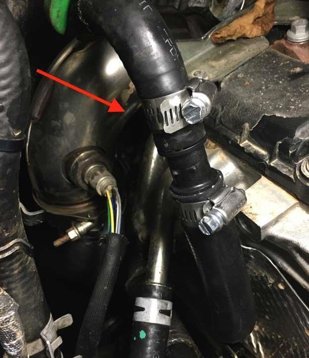 Locate the upper coolant line (the line that runs to the firewall) and install the supplied