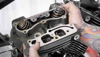 Lift the cylinder head up and off the cylinder.