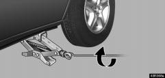 Allow for the fact that you need more ground clearance when putting on the spare tire than when removing the flat tire.