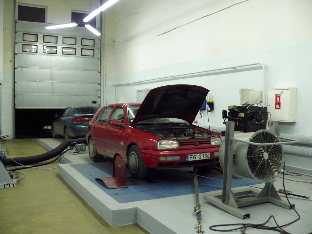 A Mustang Chassis Dynamometer MD-1750 (Fig. 3) is a rugged piece of equipment which is used to apply a load to the test vehicle.