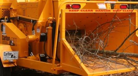 Start feeding smaller diameter trees and brush first and work your way up to the full capacity of the chipper, which is 18 diameter material.