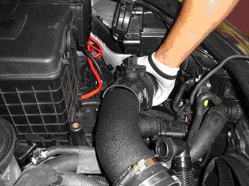 Now slide the pipe that attaches onto the intake manifold as shown.