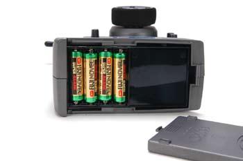 Install the four (4) AA-size batteries into the base, noting polarity when inserting