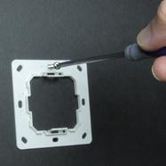 holes. After the exact location is chosen, take one screw and place it in one of the holes in the rear mounting plate.