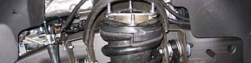 Remove upper ball joint nut and separate it by hitting the side of the