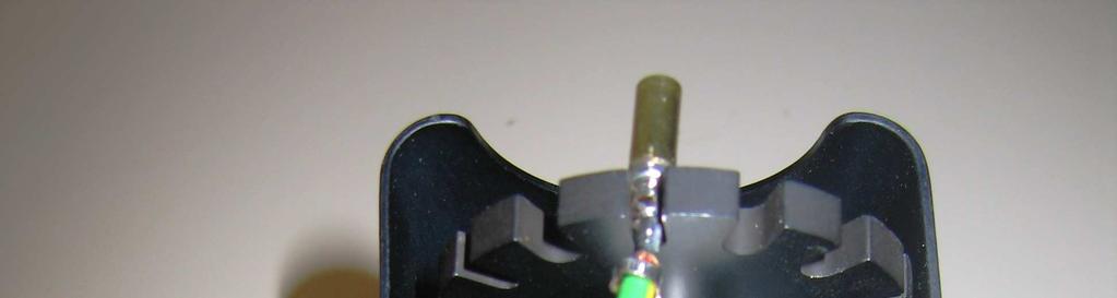 Remove the tested terminal from the upper grip assembly, and
