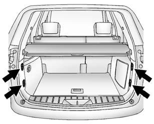 To remove the cover from the vehicle, pull both ends toward each other. To reinstall, place each end of the cover in the holes behind the rear seat.