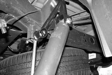 USE CAUTION WHEN WORKING WITH COIL SPRING COMPRESSORS, THEY CAN BE UNDER EXTREME LOAD.