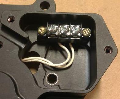 6 Attach terminal block (1) inside electrical compartment using two screws (30) with
