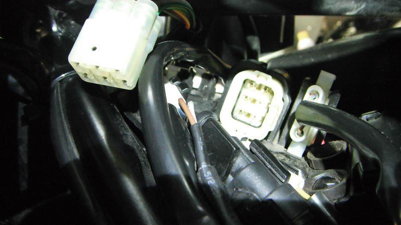 INSTALLATION of THROTTLE HARNESS 1. Disconnect the negative side of the battery located under the seat of the motorcycle. 2. Remove the Fuel Tank. 3.