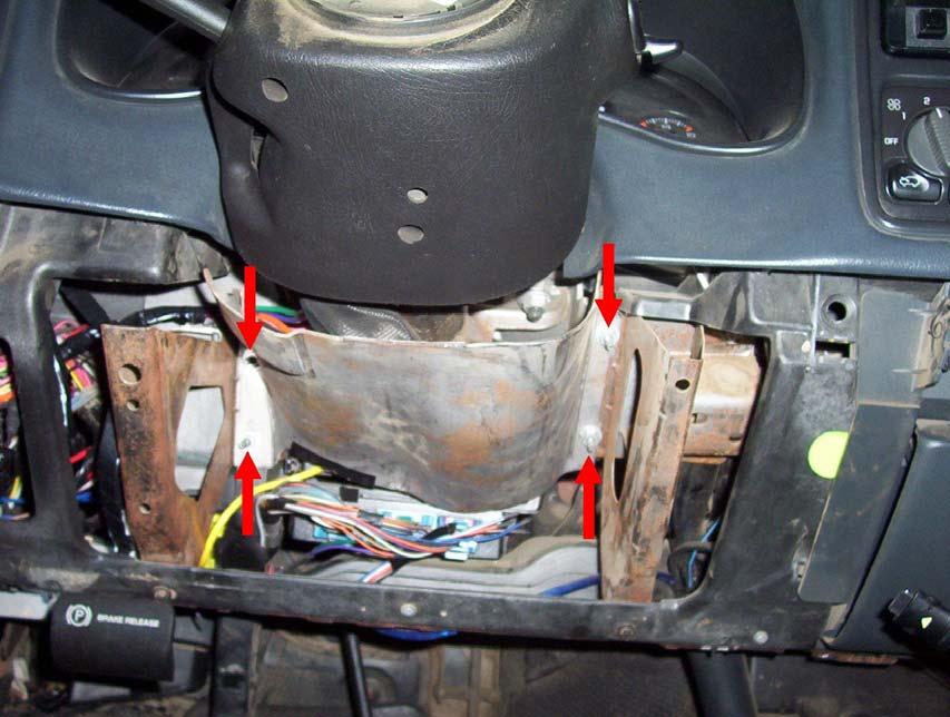 11. Remove the metal brace around the bottom of the steering column. It s held on by four nuts. 12. Remove the two T25 Torx screws from the bottom column cover.