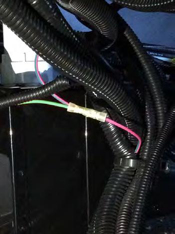 Cut the pink and green wire, and strip the insulation from both ends. Use a yellow-to-blue butt connector to attach the green wire to the pink wire with green stripe wires.