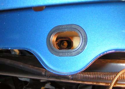 k. Verify ratchet tube is visible through hole in bed and plastic ratchet tube guide.