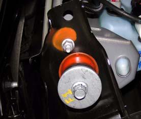 Loosen, but DO NOT REMOVE, cab mounting bolts on driver
