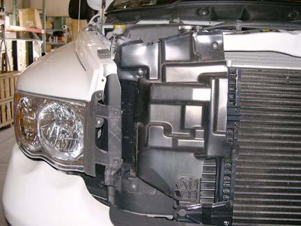 Remove intercooler piping from intercooler to prevent binding or damage when installing body lift blocks.